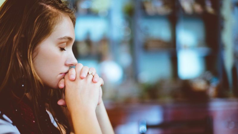 A woman praying -What is fear according to the Bible?